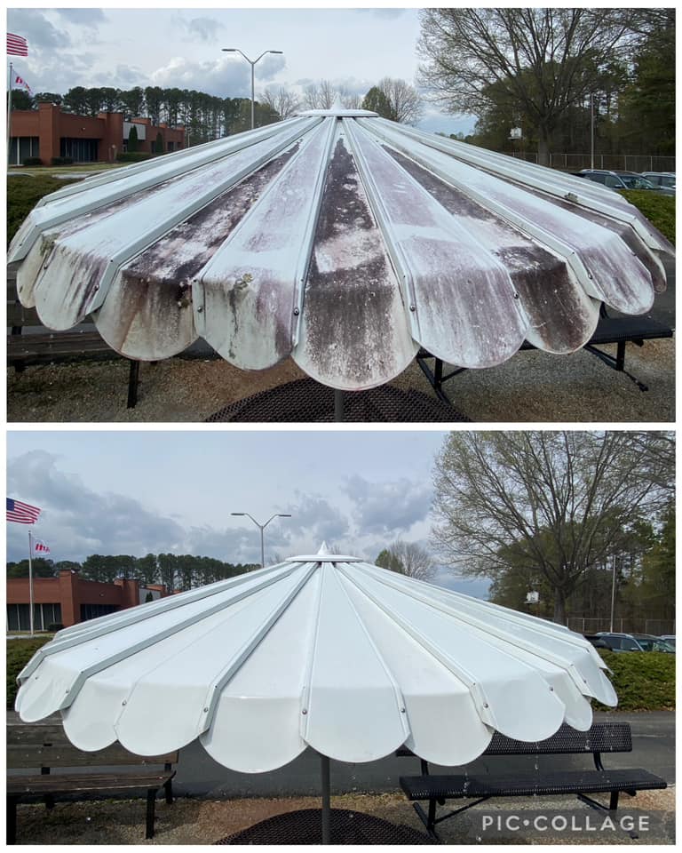 Before and after pressure washing of a large outdoor metal umbrella structure